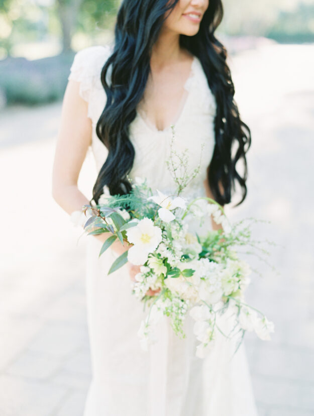 bride with all white flower bouquet